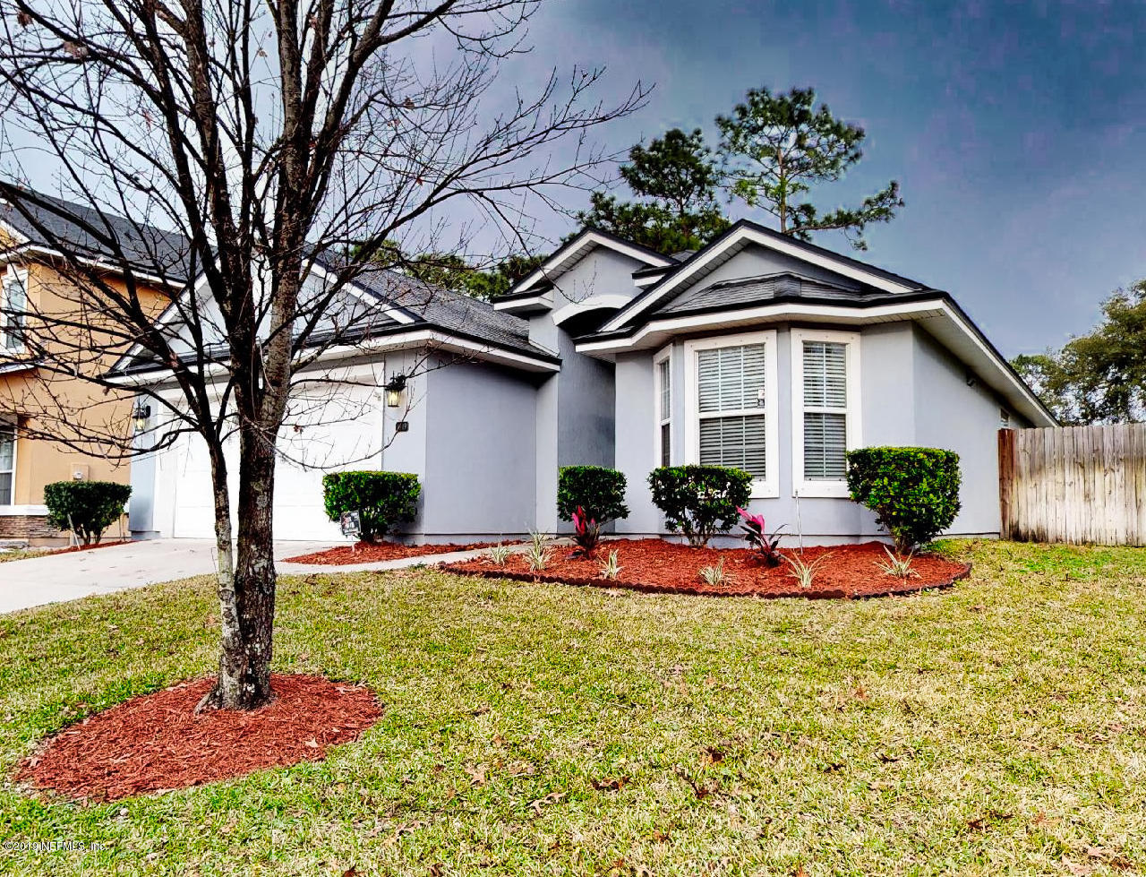 1919 Derringer Road Jacksonville, FL 32225 - Photo 2 of 42 a front view of a house with a yard