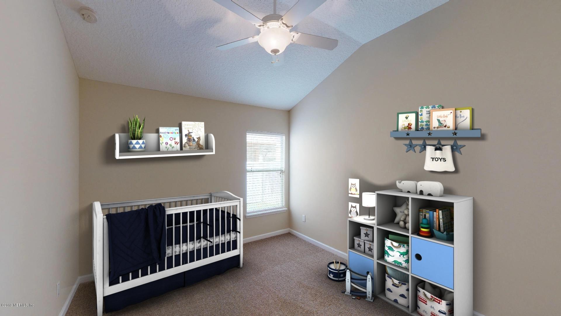 1919 Derringer Road Jacksonville, FL 32225 - Photo 29 of 42 a bedroom with furniture and a window