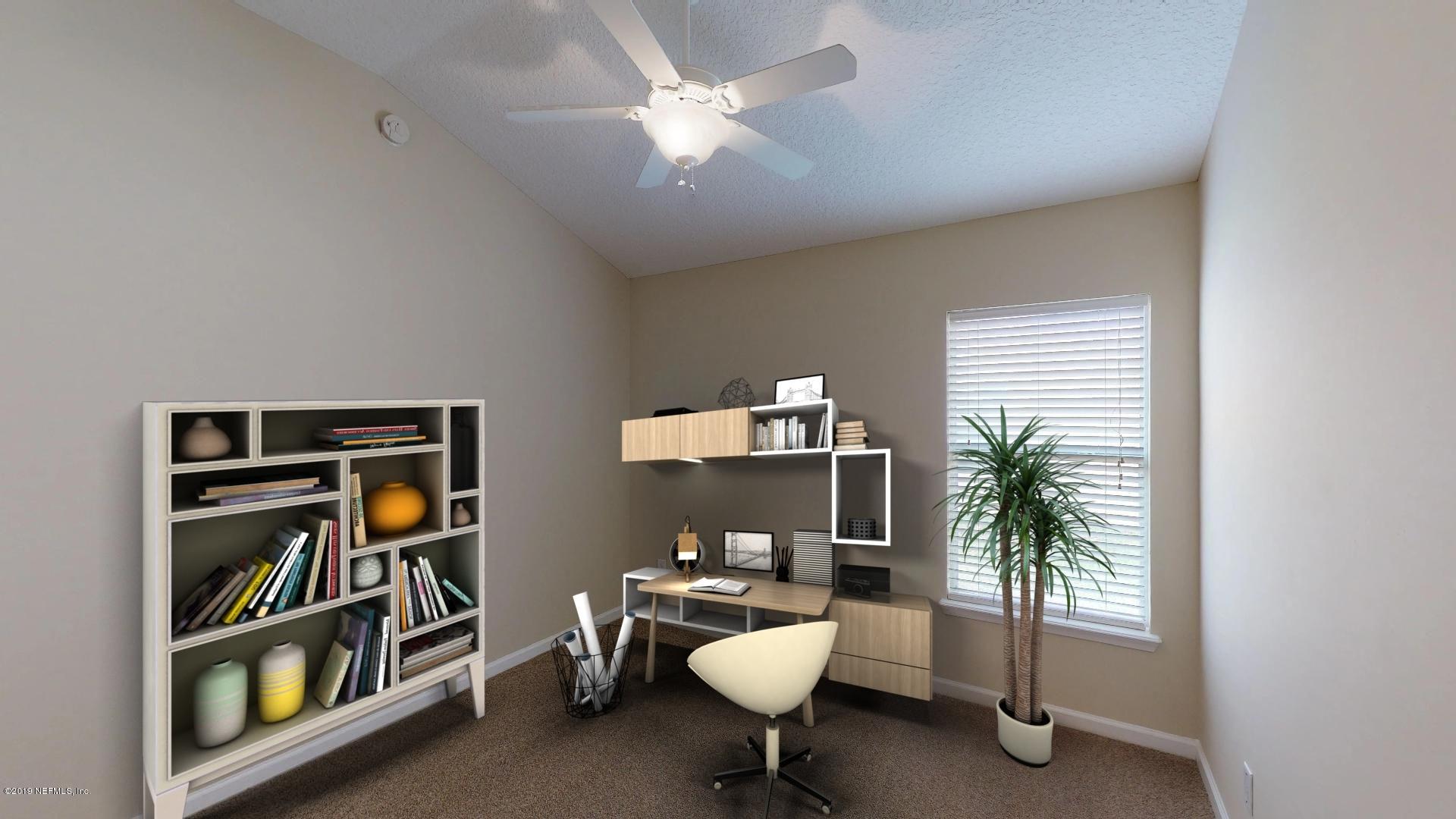1919 Derringer Road Jacksonville, FL 32225 - Photo 31 of 42 a living room with furniture and a potted plant