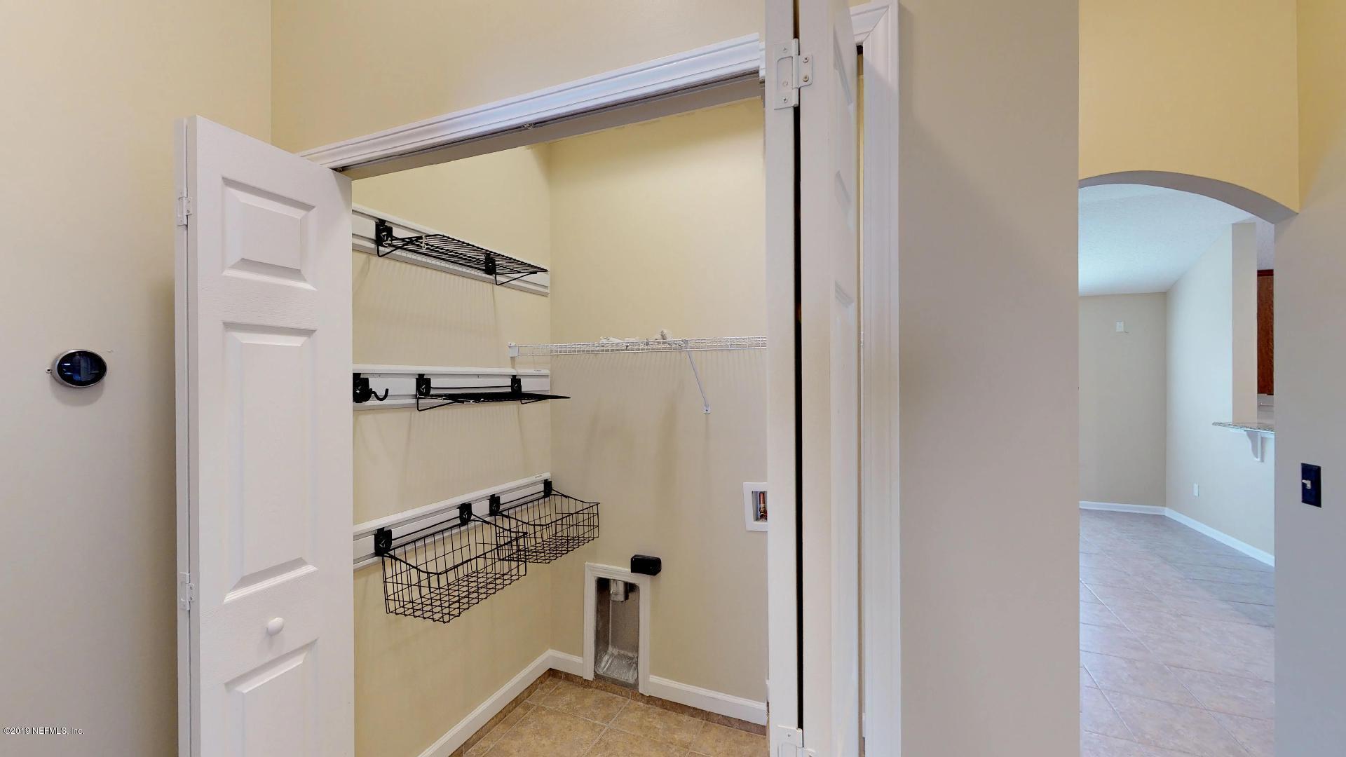 1919 Derringer Road Jacksonville, FL 32225 - Photo 32 of 42 a bathroom with a sink a mirror and shower