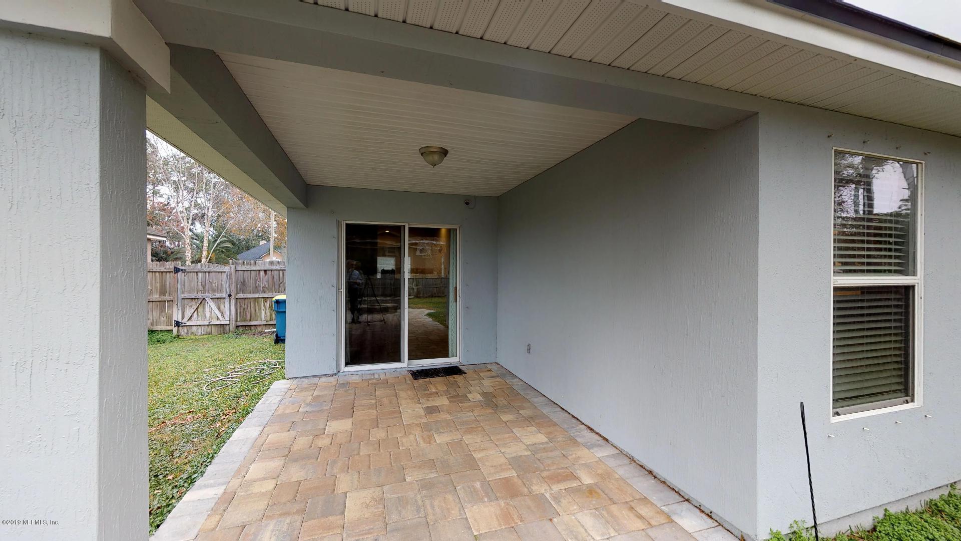 1919 Derringer Road Jacksonville, FL 32225 - Photo 34 of 42 a view of a porch with a table and garden