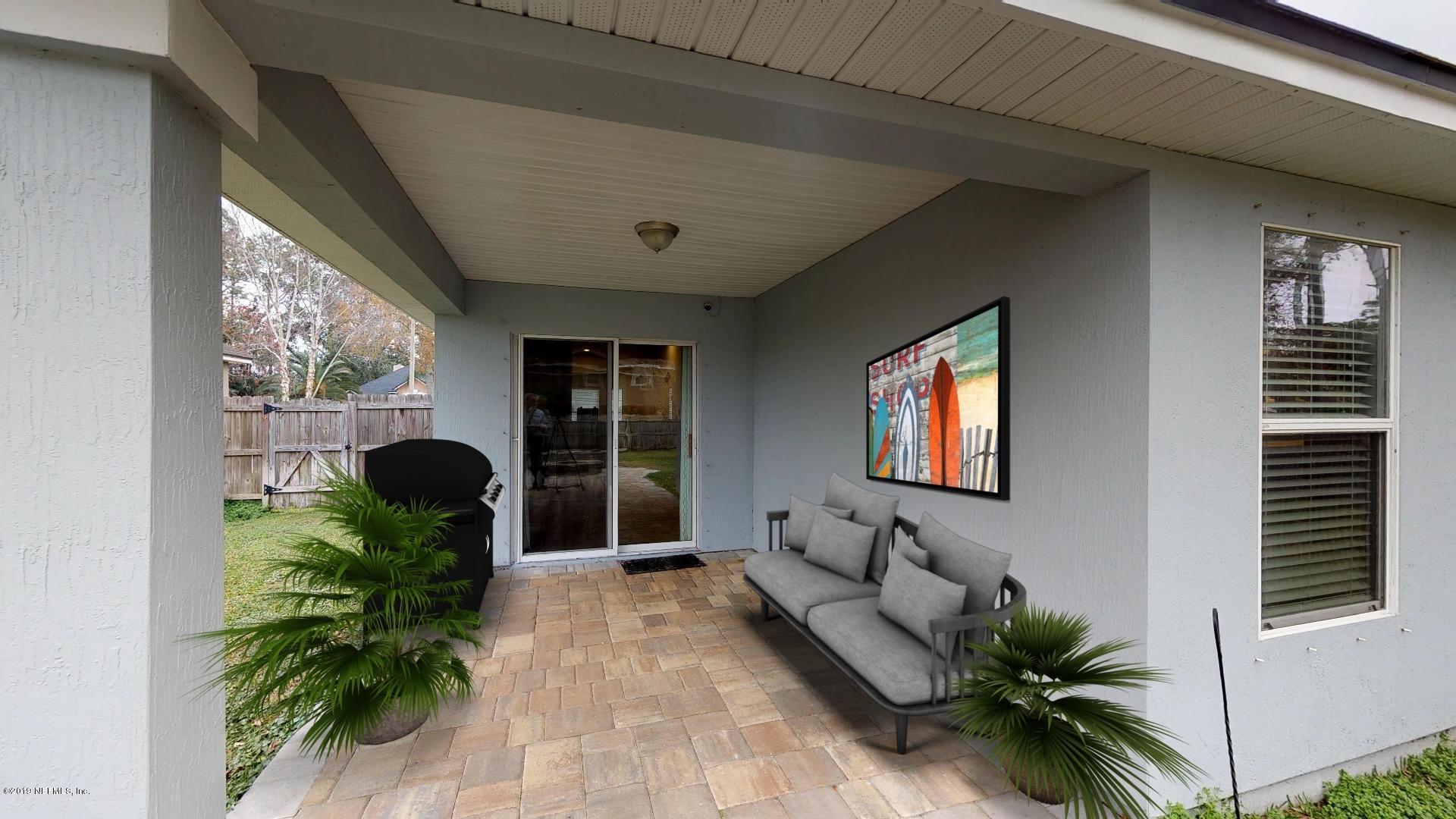 1919 Derringer Road Jacksonville, FL 32225 - Photo 35 of 42 a living room with furniture and a potted plant