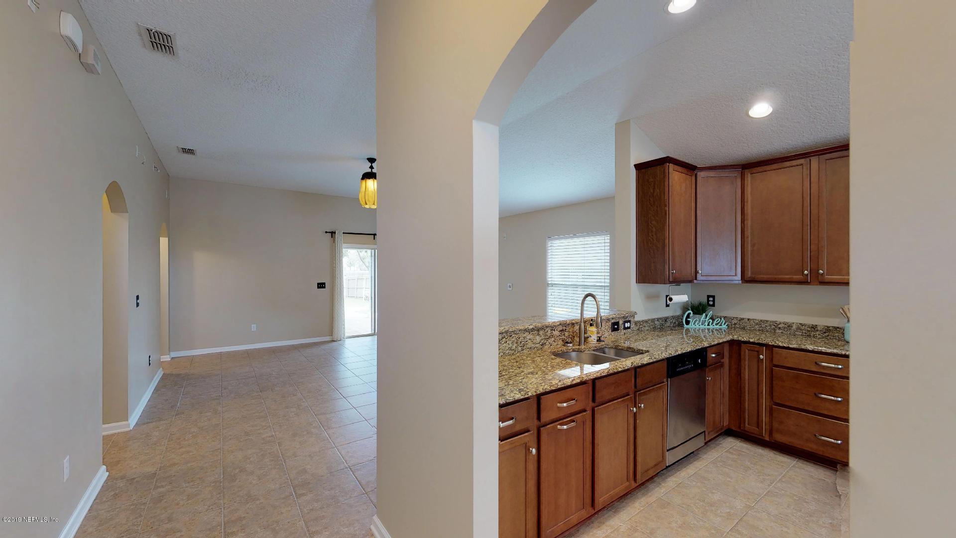 1919 Derringer Road Jacksonville, FL 32225 - Photo 5 of 42 a kitchen with a sink and cabinets
