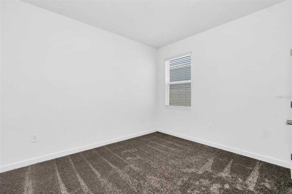 5768 Stephens Road St. Cloud, FL 34771 - Photo 35 of 50 an empty room with a window