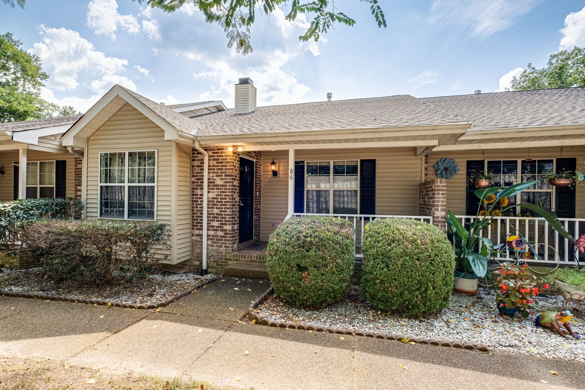 a front view of a house with garden