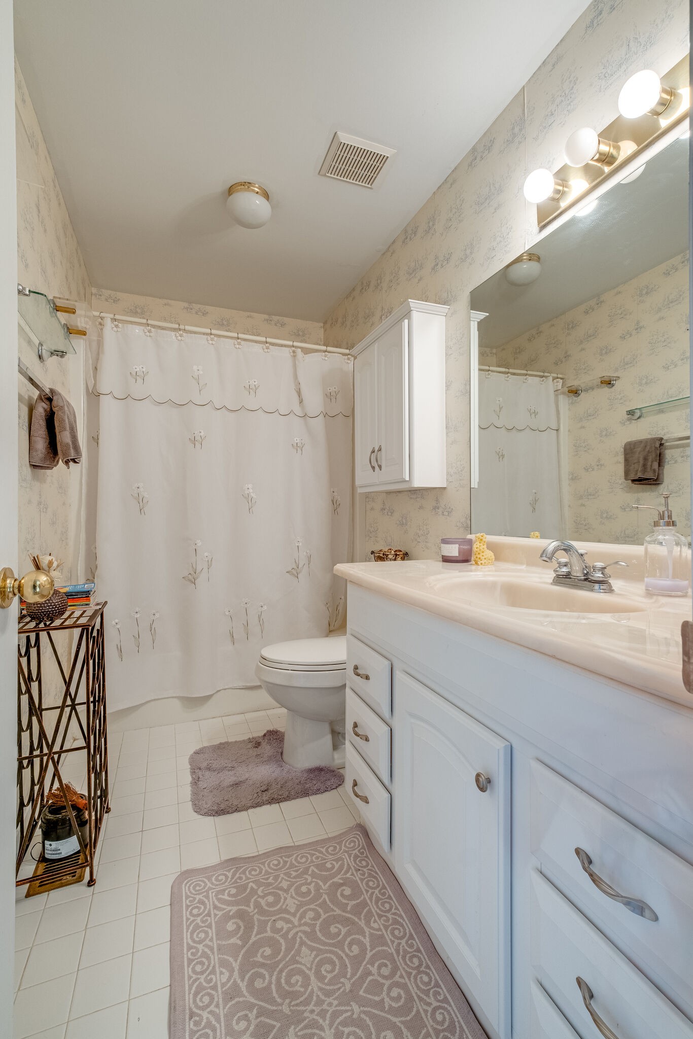 86 Pepper Ridge Circle, Unit 86 Antioch, TN 37013 - Photo 19 of 29 a bathroom with a granite countertop sink mirror vanity and toilet
