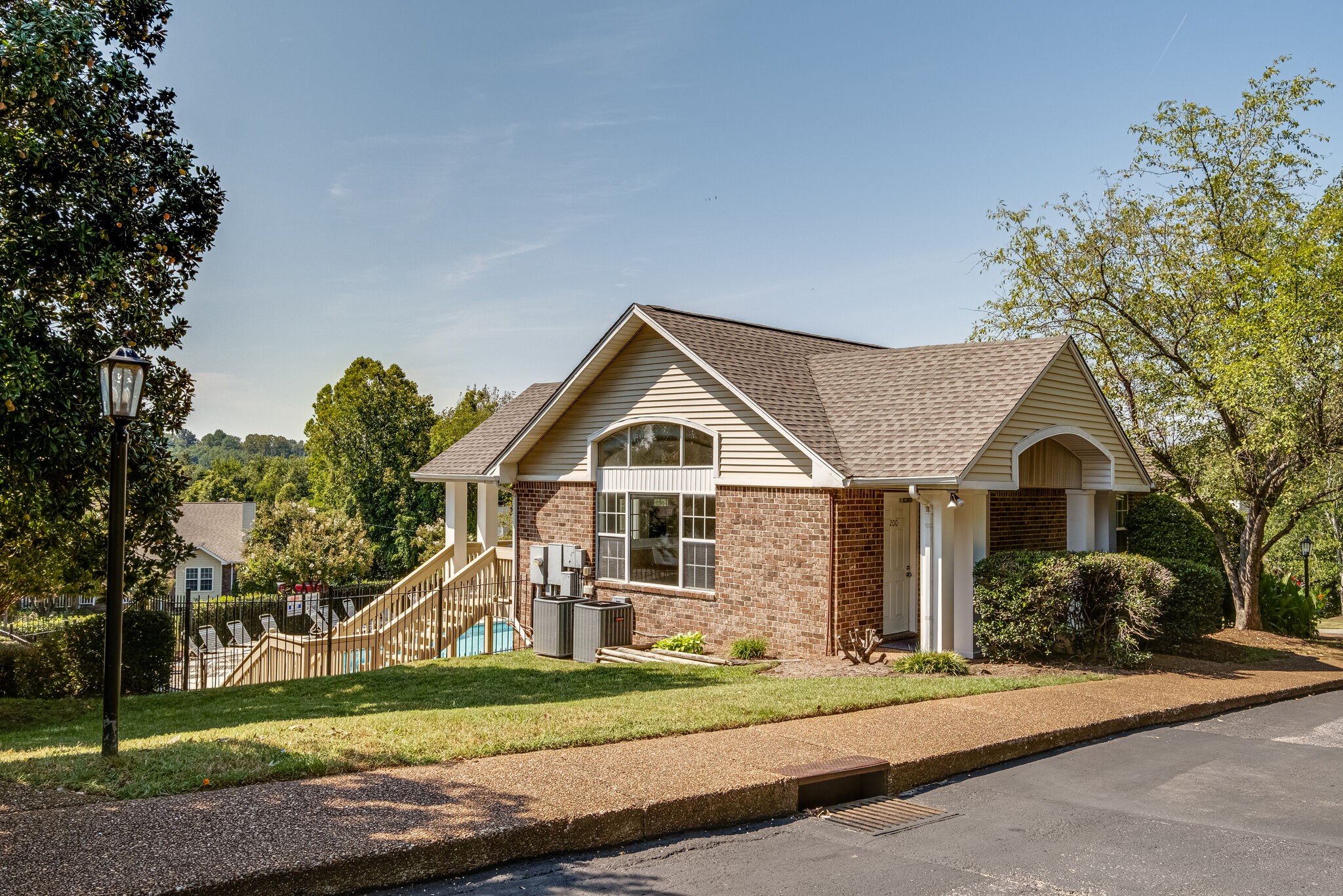 86 Pepper Ridge Circle, Unit 86 Antioch, TN 37013 - Photo 27 of 29 a front view of a house with a yard and garage