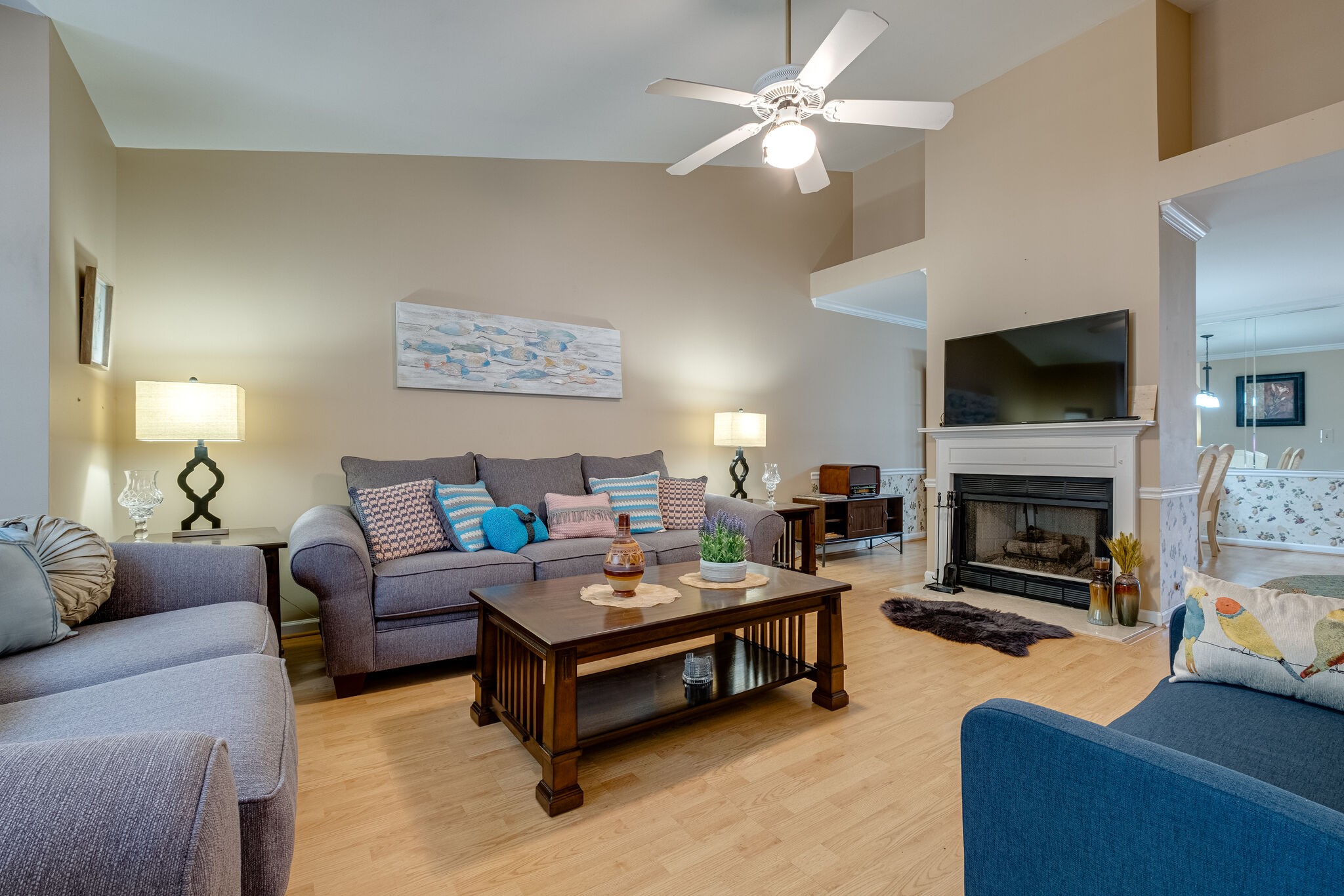 86 Pepper Ridge Circle, Unit 86 Antioch, TN 37013 - Photo 3 of 29 a living room with furniture a fireplace and a flat screen tv