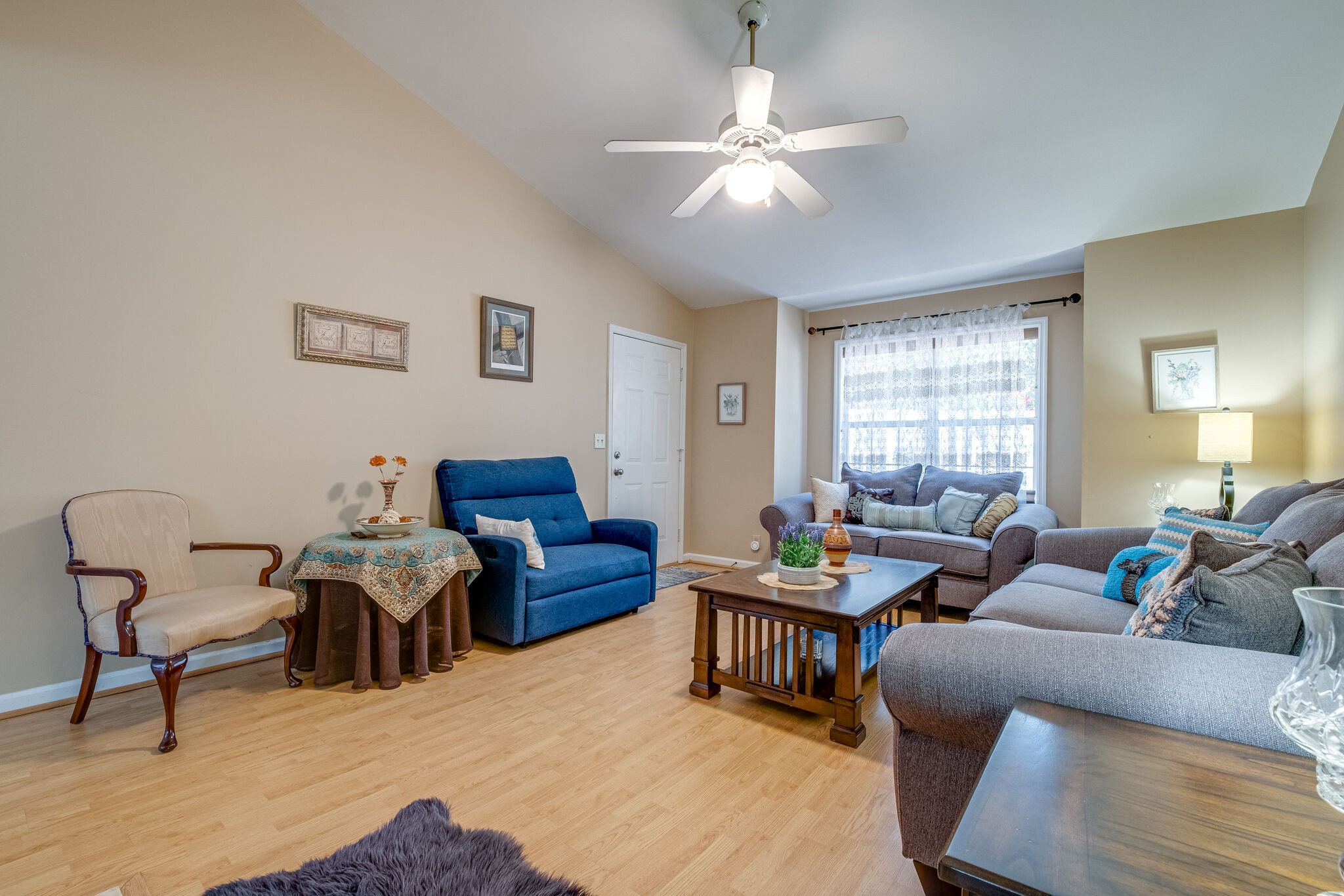 86 Pepper Ridge Circle, Unit 86 Antioch, TN 37013 - Photo 5 of 29 a living room with furniture and a chandelier