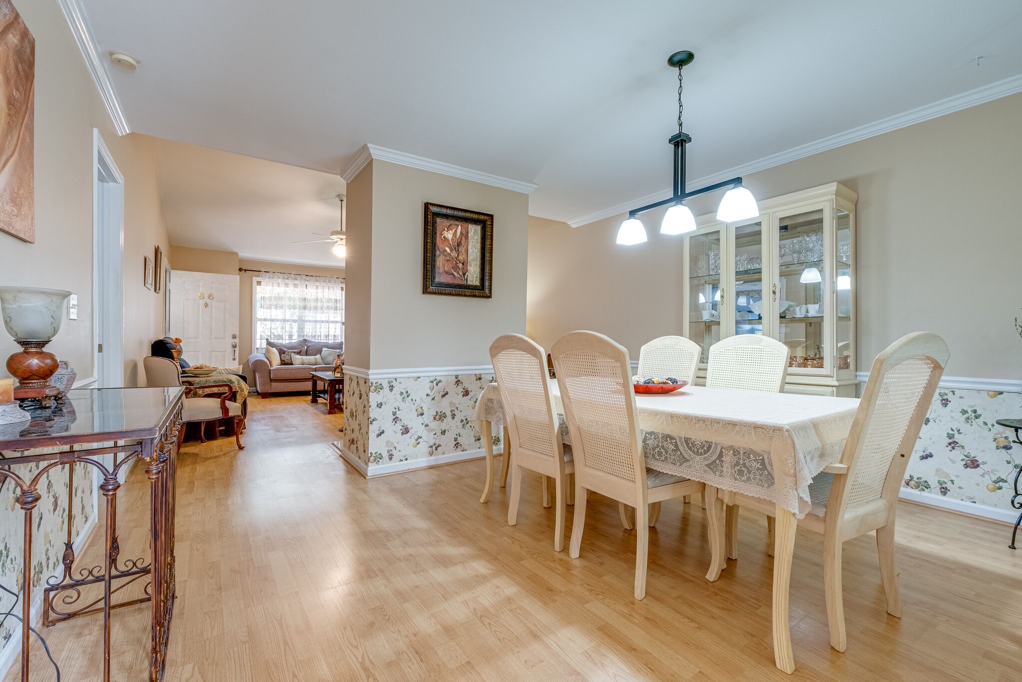 86 Pepper Ridge Circle, Unit 86 Antioch, TN 37013 - Photo 7 of 29 a dining room with furniture a chandelier and wooden floor