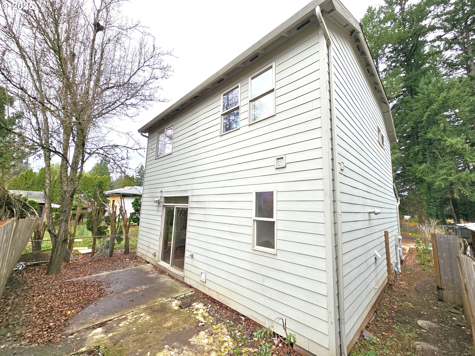 111 Northeast 149th Place Portland, OR 97230 - Photo 2 of 11 a view of a white house with a large trees