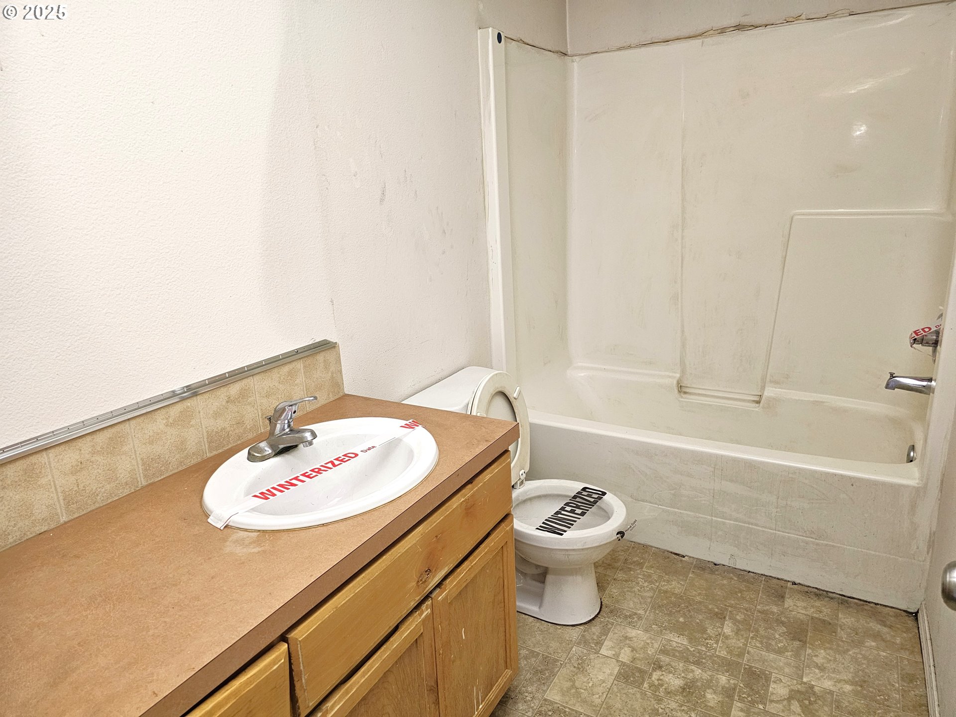 111 Northeast 149th Place Portland, OR 97230 - Photo 4 of 11 a bathroom with a sink a toilet and bathtub