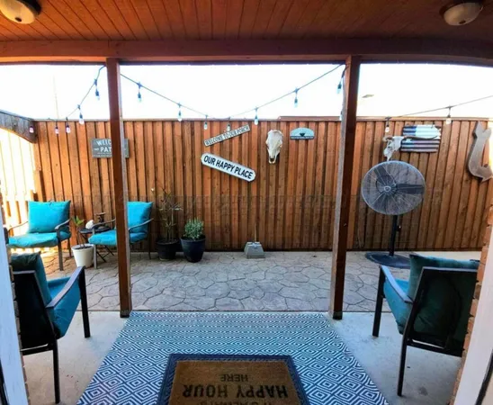 a view of a backyard with plants and a garden