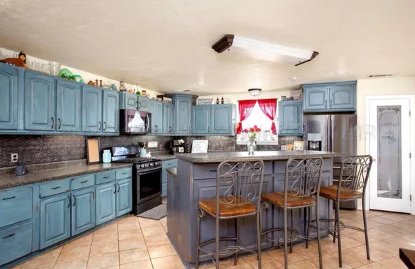 a living room with dining room and kitchen