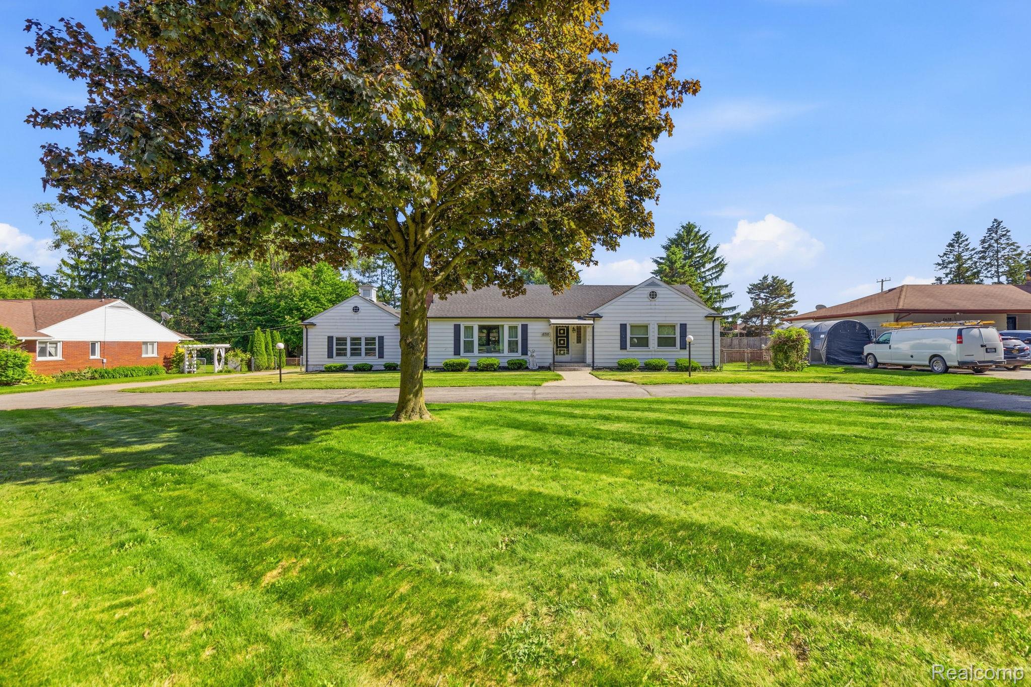 8710 32 Mile Road Washington, MI 48095 - Photo 58 of 60 Expansive front lawn with a mature deciduous tree
