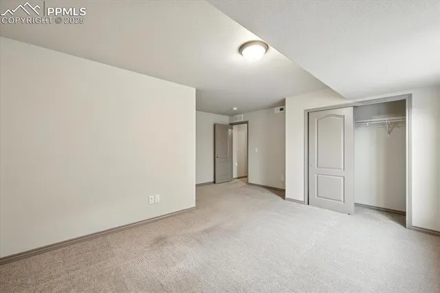 a view of a house with a big yard and potted plants