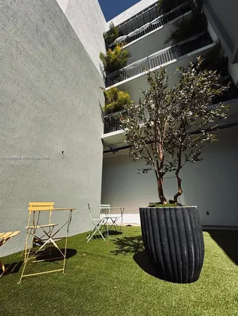 a view of backyard with trampoline