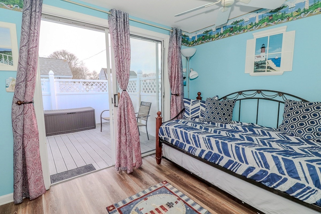 433 Lower County Road, Unit 25 Dennis, MA 02639 - Photo 15 of 32 a bedroom with a bed and a window