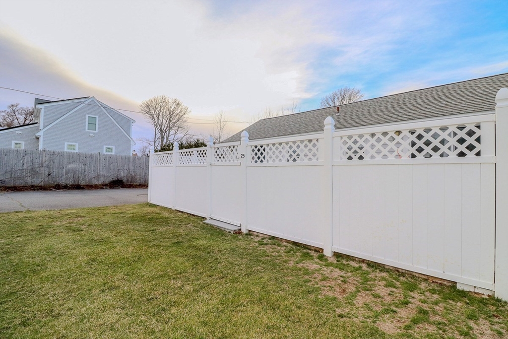 433 Lower County Road, Unit 25 Dennis, MA 02639 - Photo 22 of 32 a view of a big room with wooden fence