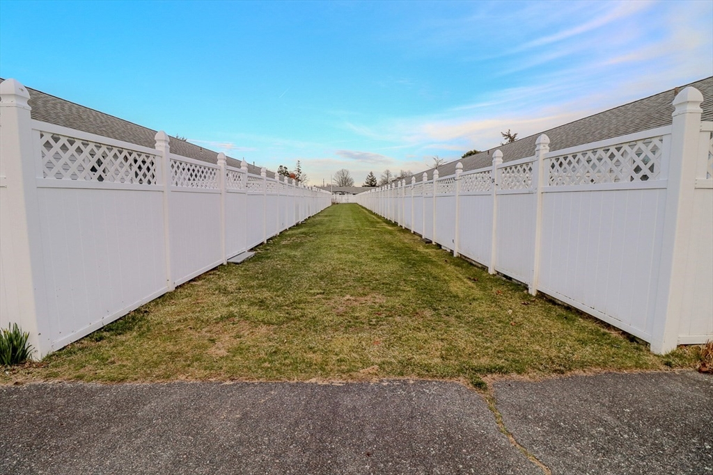 433 Lower County Road, Unit 25 Dennis, MA 02639 - Photo 24 of 32 a view of a backyard
