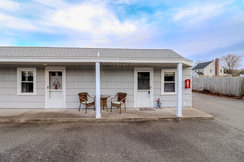 433 Lower County Road, Unit 25 Dennis, MA 02639 - Photo 26 of 32 a view of a house with a patio