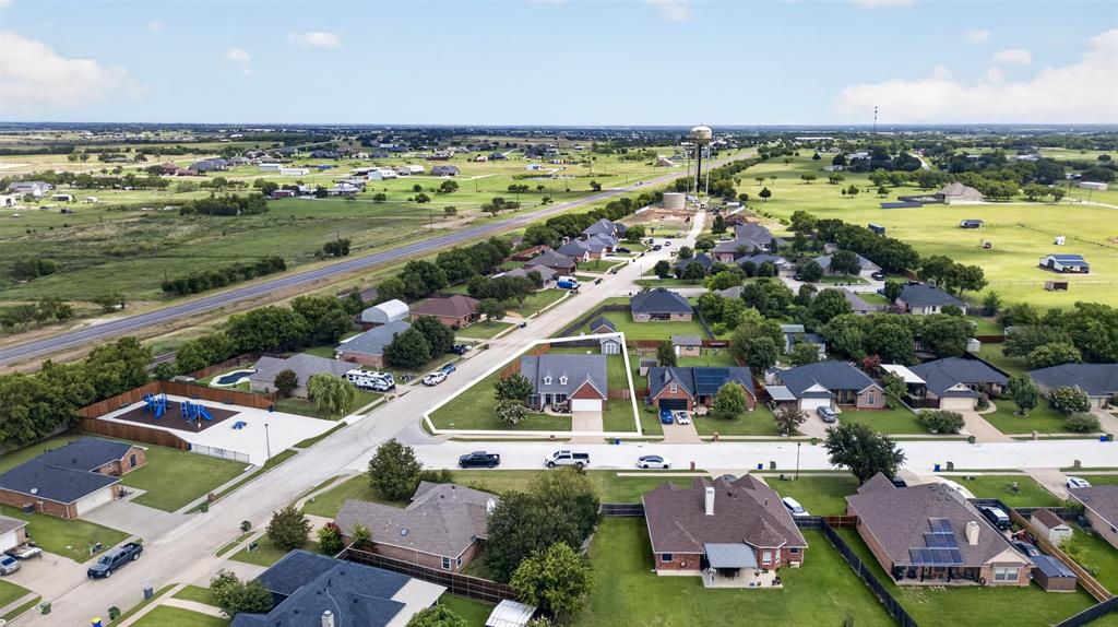 100 Radecke Road Krum, TX 76249 - Photo 6 of 29 Aerial perspective showcasing a residential neighborhood with varied architectural styles
