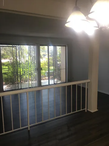 a view of wooden floor and brick walls