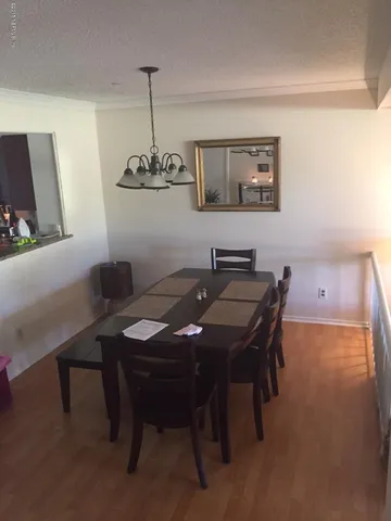 a dining room with a table and chairs