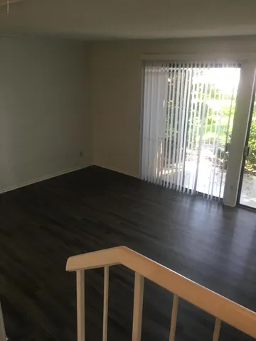 a view of wooden floor and brick walls