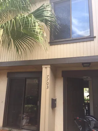 a view of entryway with a wooden door