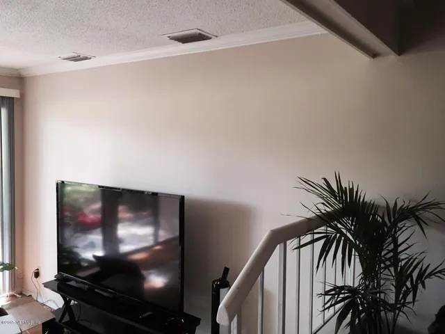 a view of a living room with a flat screen tv