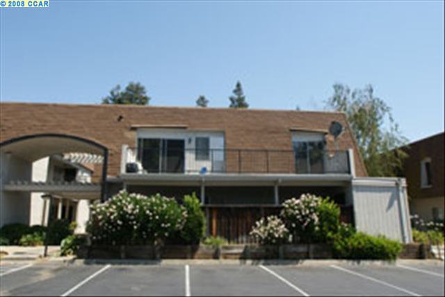 a front view of a building with garden
