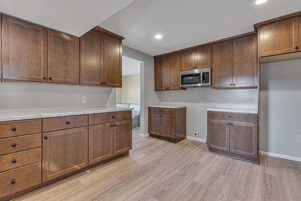 589 Pine Run Road Freedom, PA 15042 - Photo 13 of 29 a kitchen with stainless steel appliances granite countertop a stove a sink and a refrigerator