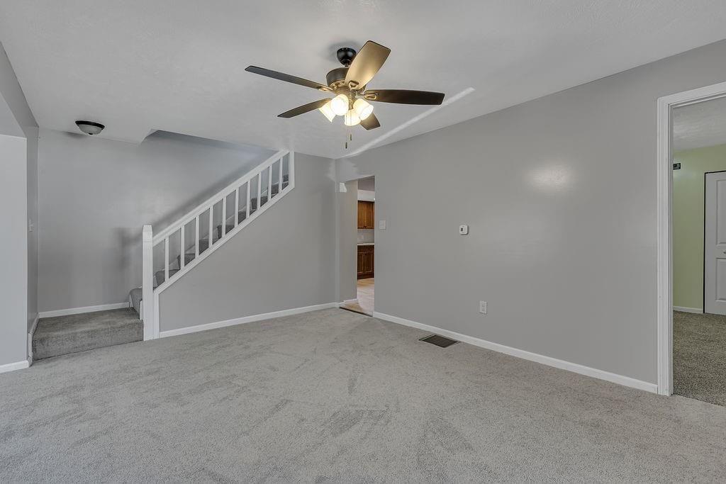 589 Pine Run Road Freedom, PA 15042 - Photo 17 of 29 a view of an empty room with a ceiling fan