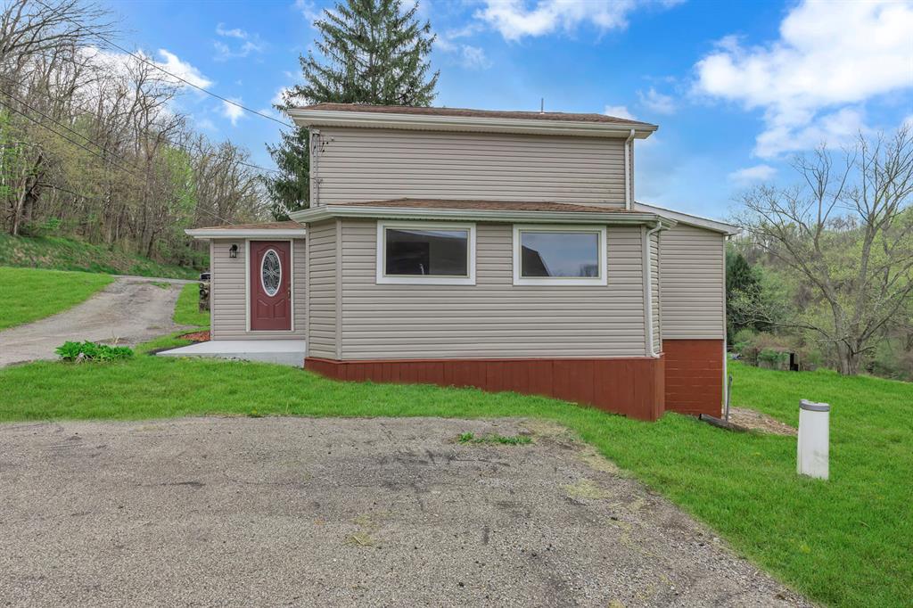 589 Pine Run Road Freedom, PA 15042 - Photo 2 of 29 a front view of house with yard and green space