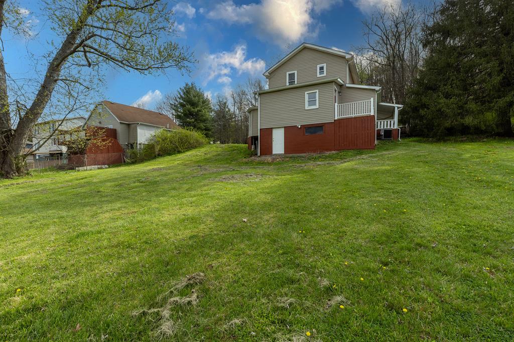 589 Pine Run Road Freedom, PA 15042 - Photo 7 of 29 a front view of a house with a yard