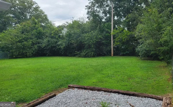 a view of a backyard with a small cabin