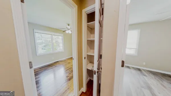 a view of an entryway with wooden floor
