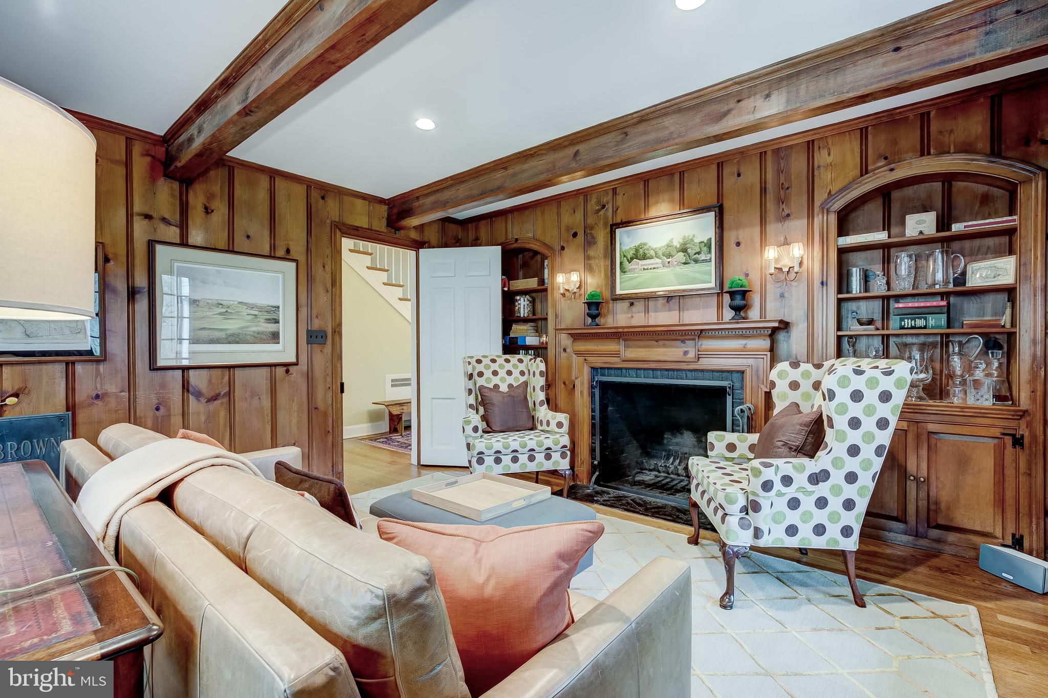 325 Garrison Forest Road Owings Mills, MD 21117 - Photo 31 of 51 Den with fireplace and wood paneling