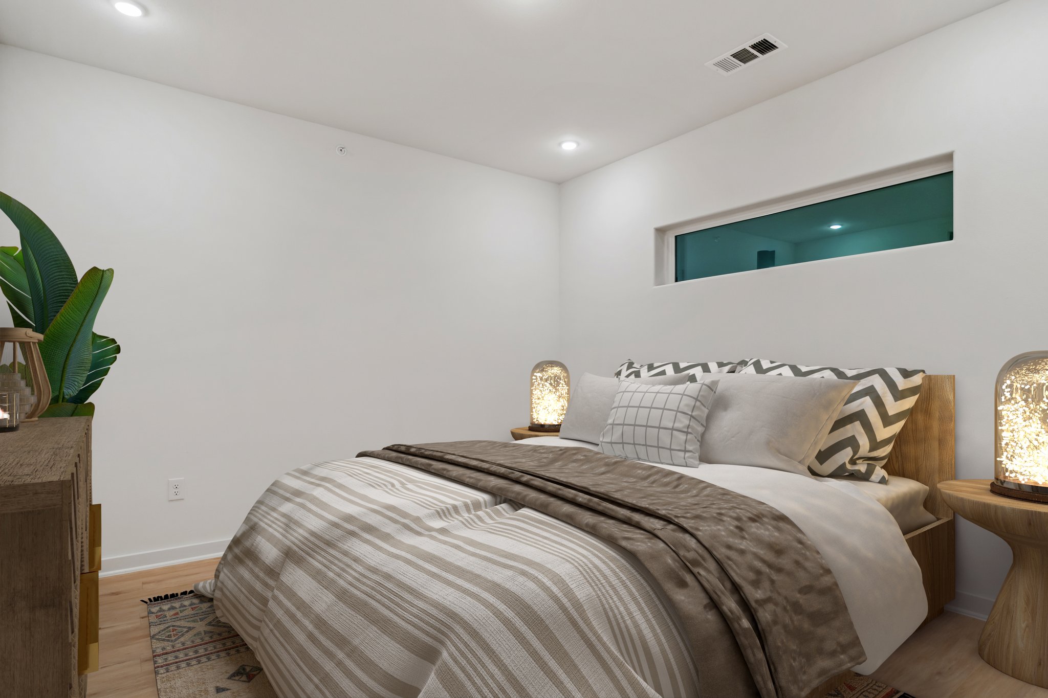 100 West Mockingbird Lane Austin, TX 78745 - Photo 11 of 24 a bedroom with bed and a potted plant