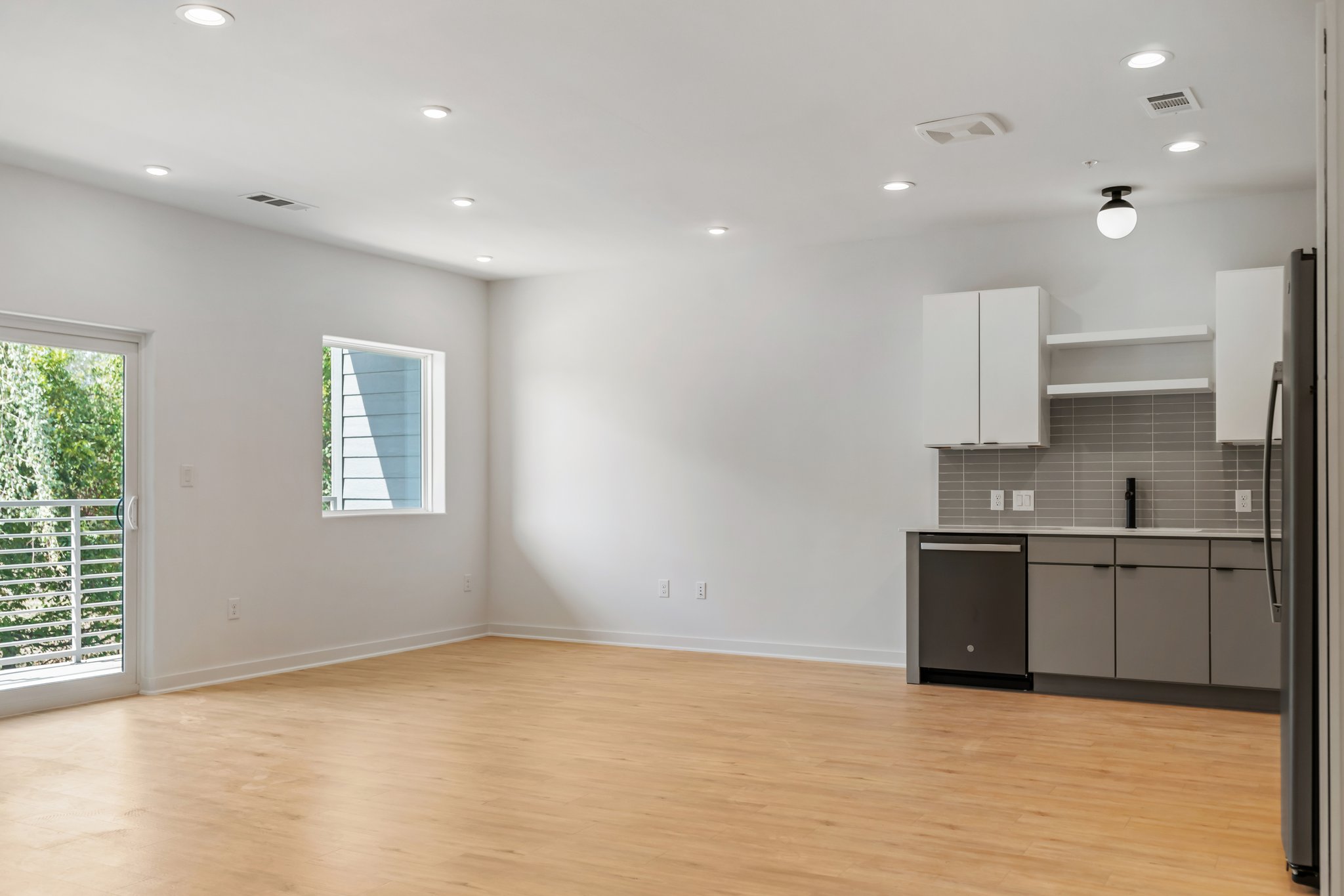 100 West Mockingbird Lane Austin, TX 78745 - Photo 3 of 24 a large kitchen with stainless steel appliances granite countertop a stove a sink and a refrigerator