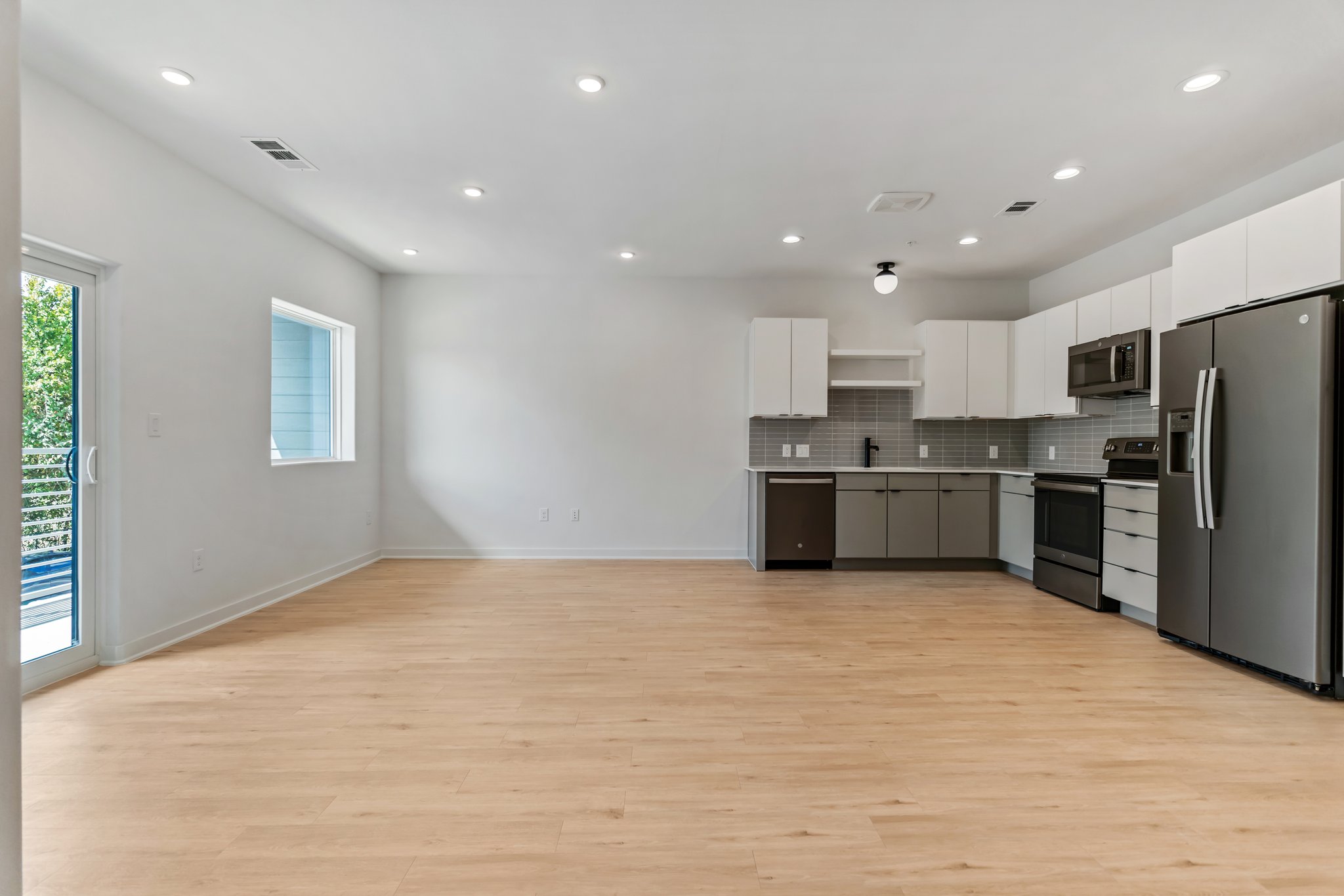 100 West Mockingbird Lane Austin, TX 78745 - Photo 5 of 24 a view of kitchen with kitchen island a sink stainless steel appliances and cabinets