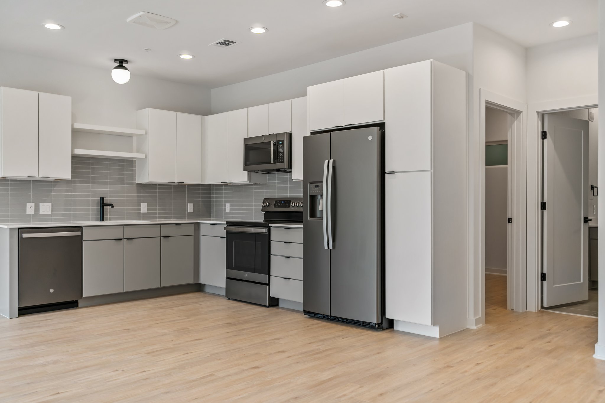 100 West Mockingbird Lane Austin, TX 78745 - Photo 8 of 24 a kitchen with stainless steel appliances a refrigerator sink and microwave