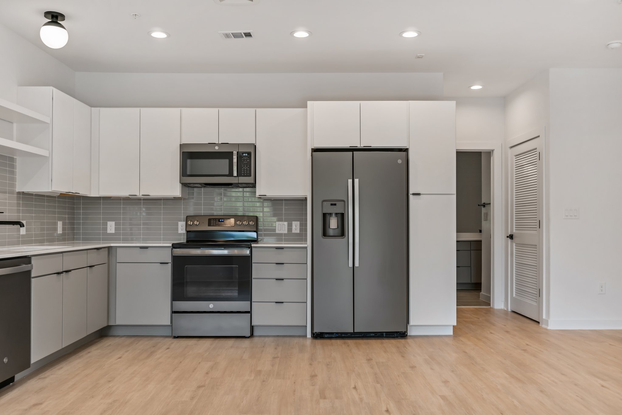 100 West Mockingbird Lane Austin, TX 78745 - Photo 9 of 24 a kitchen with stainless steel appliances a refrigerator and a stove top oven