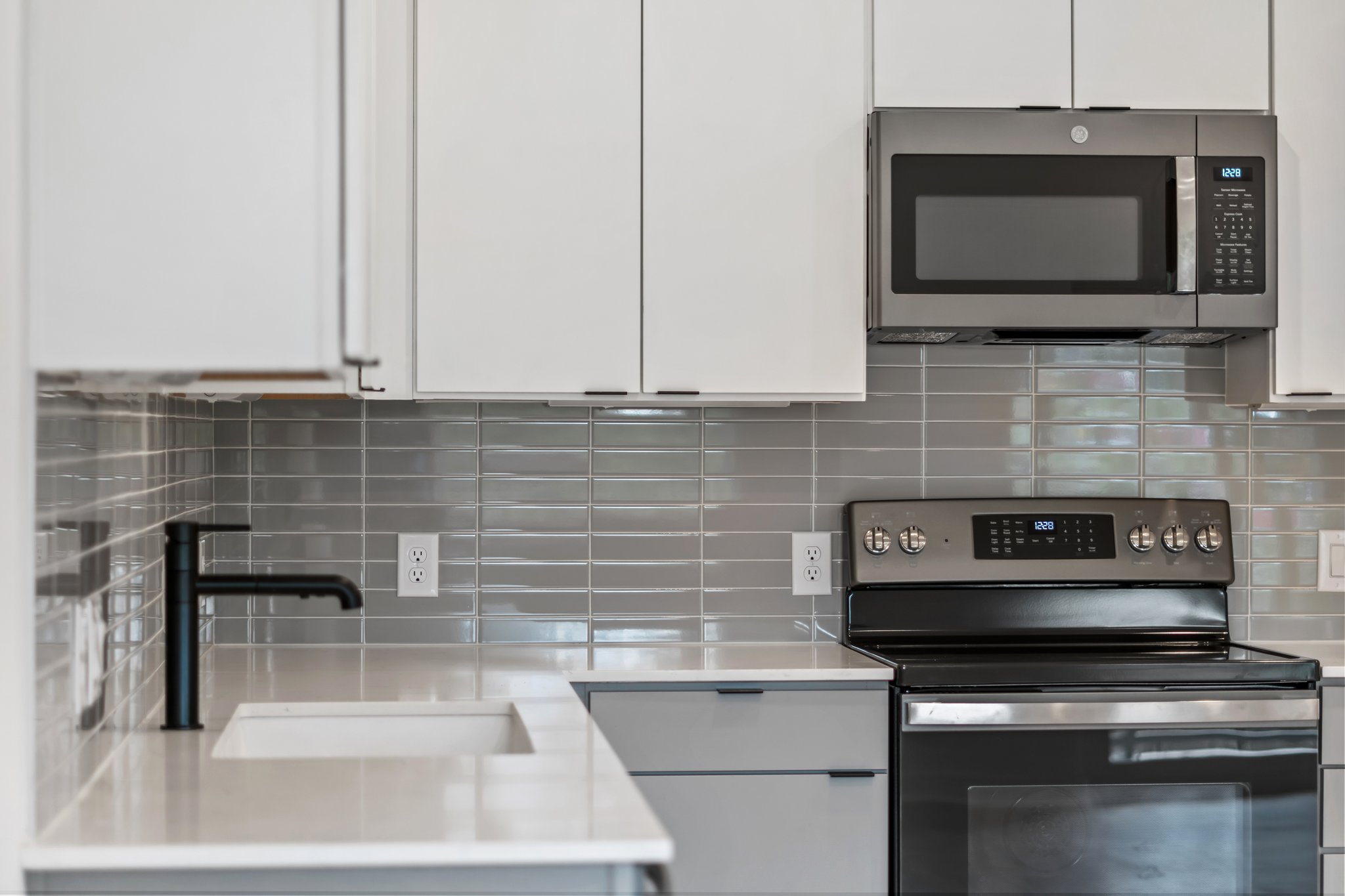 100 West Mockingbird Lane Austin, TX 78745 - Photo 10 of 24 a kitchen with stainless steel appliances wooden cabinets and a stove top oven