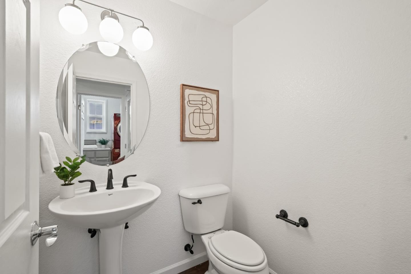 451 Chagall Street Mountain View, CA 94041 - Photo 23 of 58 a bathroom with a sink a toilet and mirror