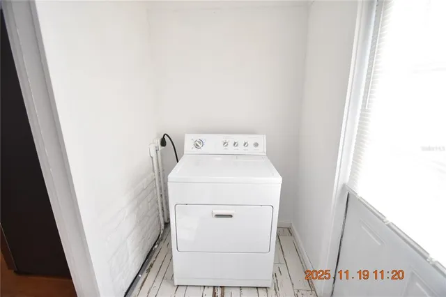 a utility room with dryer and washer