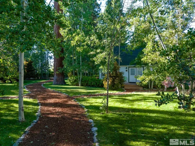 a view of a lake with a yard