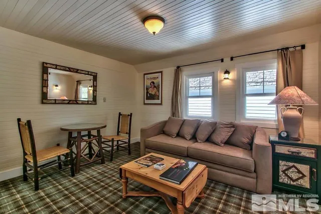 a kitchen with a refrigerator and a stove top oven