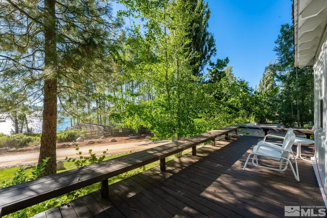 a view of a chairs and table in the patio